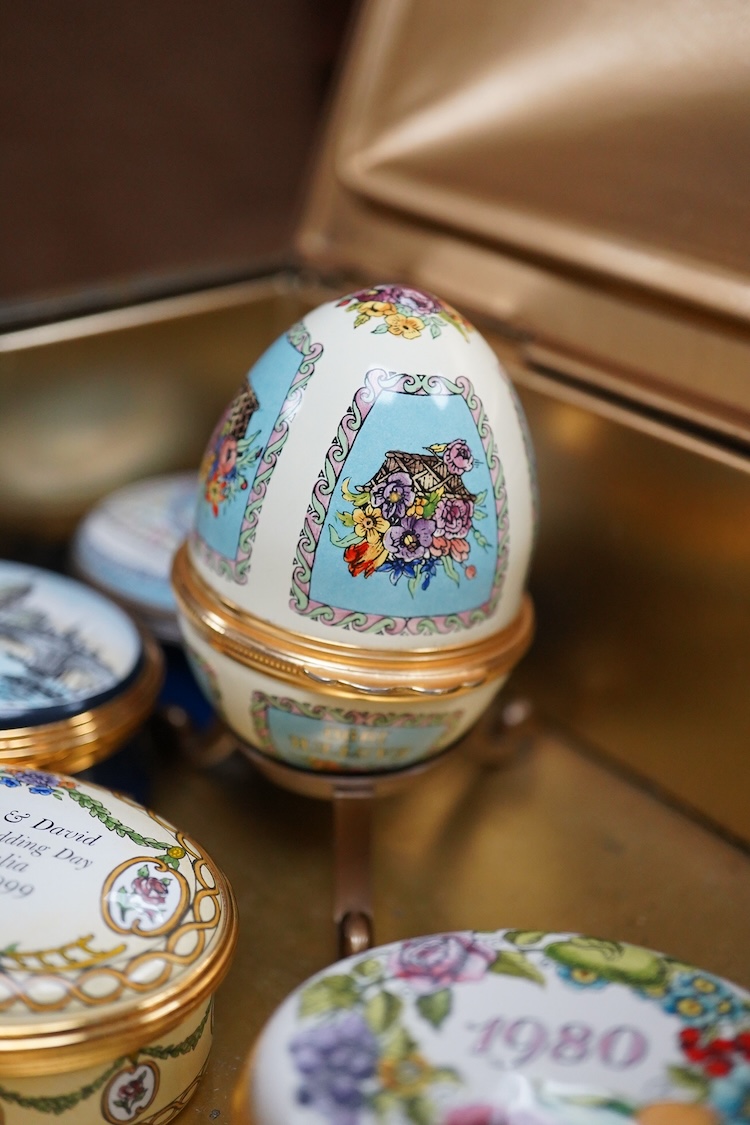 Eight Halcyon days enamel year boxes and an enamel egg shaped box on stand (9)